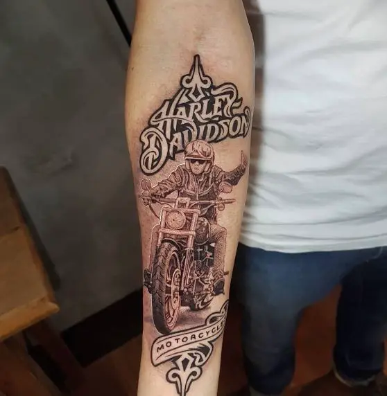 Black and Grey Man Riding Harley Davidson Forearm Tattoo
