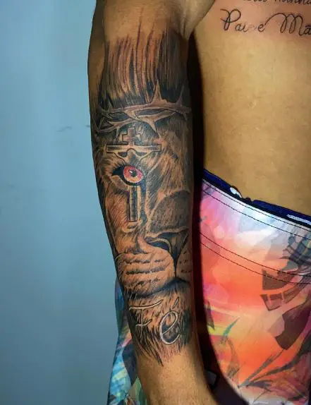 Lion Head with Thorn Crown and Cross Forearm Tattoo