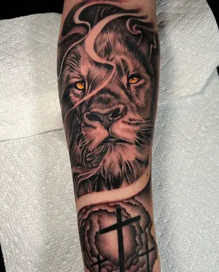 Three Crosses and Lion Forearm Tattoo