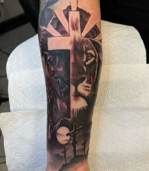 Crucifixion, Jesus and Lion Forearm Tattoo