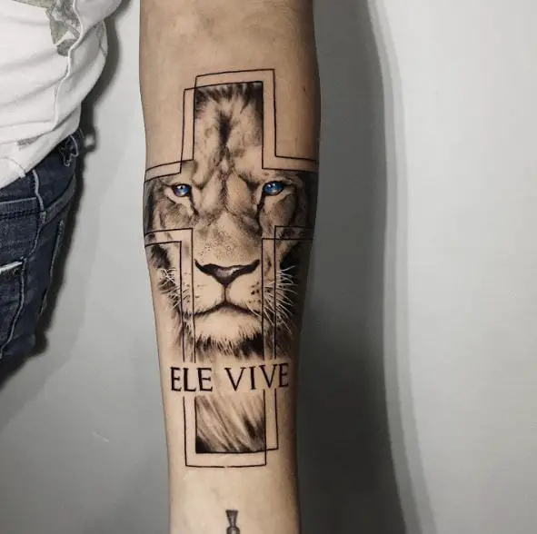Cross and Lion with Blue Eyes Forearm Tattoo
