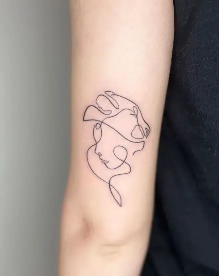 Minimalistic Woman Face and Lioness Forearm Tattoo
