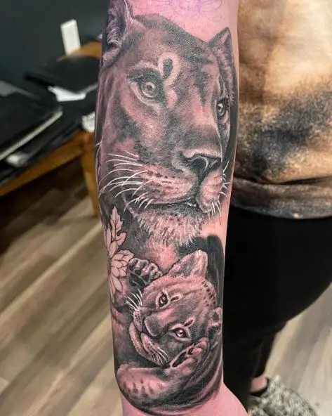 Black and Grey Lioness with Cub Forearm Tattoo