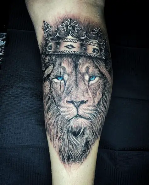 Lion with Blue Eyes and Crown Leg Tattoo