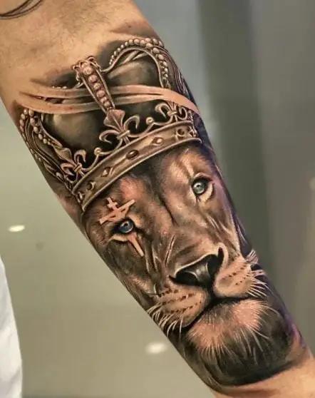 Lion with Crown and Crucifixion Forearm Tattoo