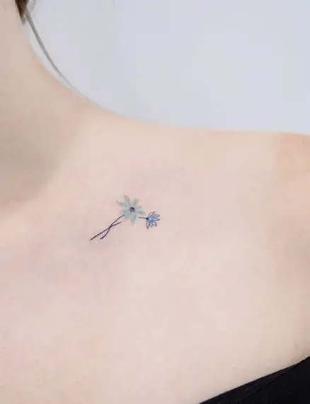 Minimalistic Blue Flowers Collarbone Tattoo