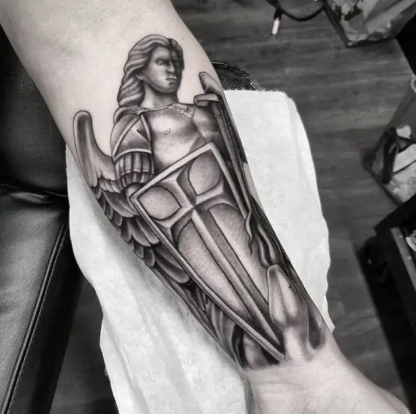 Black and Grey Saint Michael with Shield and Sword Forearm Tattoo