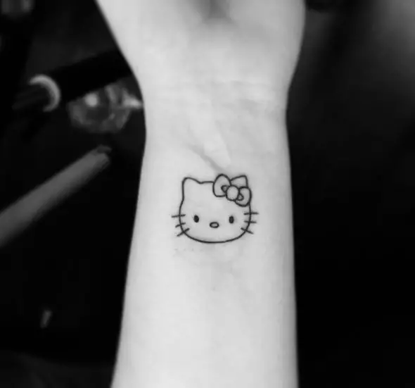 Black Minimalistic Hello Kitty Head Wrist Tattoo