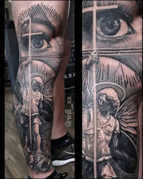Black and Grey Eye and Saint Michael with Cross, Shield and Wings Leg Tattoo