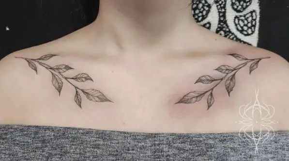 Black and Grey Branches with Leaves Collarbone Tattoo
