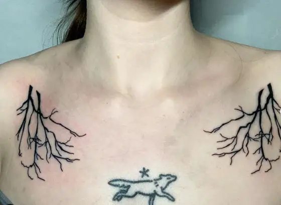 Black Symmetrical Tree Branches Collarbone Tattoo