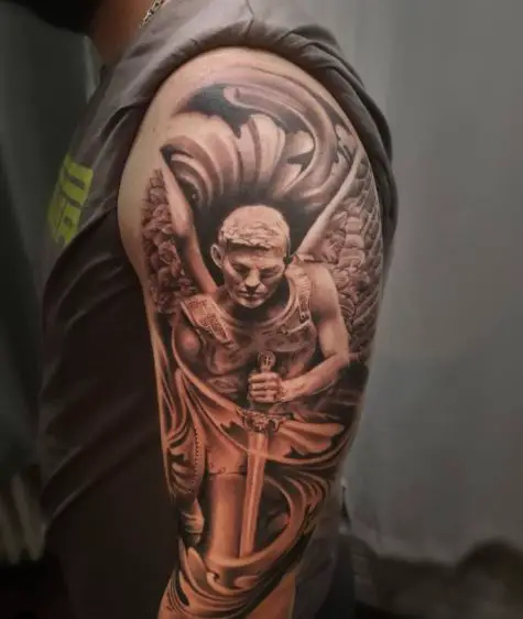 Black and Grey Saint Michael with Sword and Wings Arm Tattoo