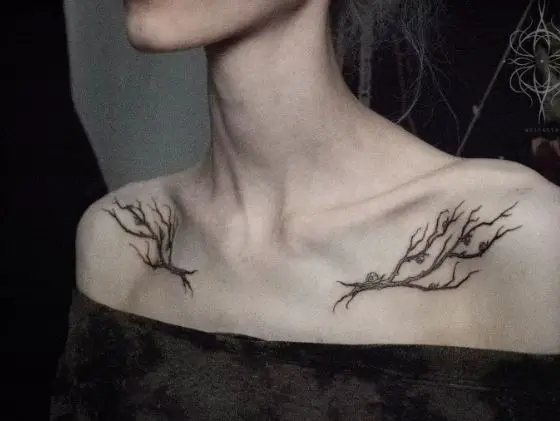 Black and Grey Branches with Snails Collarbone Tattoo