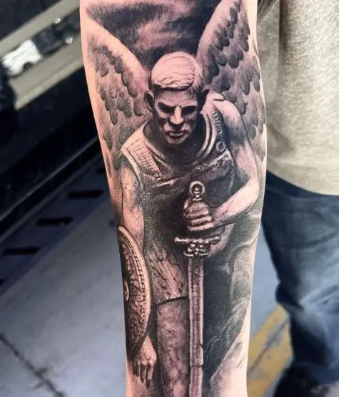 Black and Grey Saint Michael with Sword, Shield and Wings Arm Tattoo