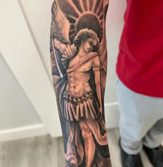 Black and Grey Saint Michael with Sword, and Wings Forearm Tattoo