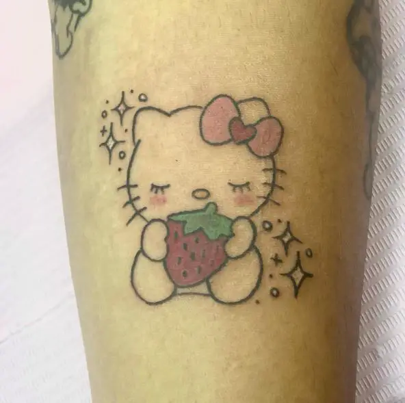Colorful Hello Kitty with Strawberry and Stars Forearm Tattoo