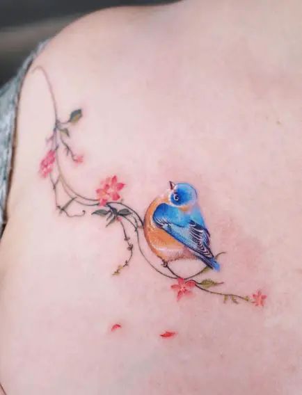 Colorful Branch with Flowers, and Bird Collarbone Tattoo