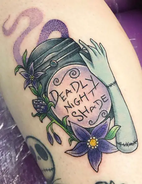 Colorful Sally Arm and Deadly Nightshade Leg Tattoo