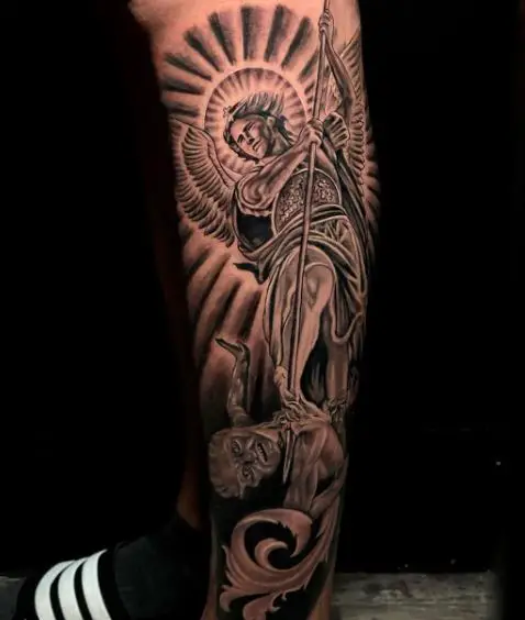 Sun and Saint Michael with Spear Defeating Satan Leg Tattoo