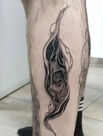 Black and Grey Half Skull Abstract Calf Tattoo
