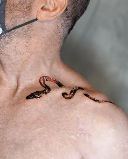 Flower Patterned Snake Collarbone Tattoo