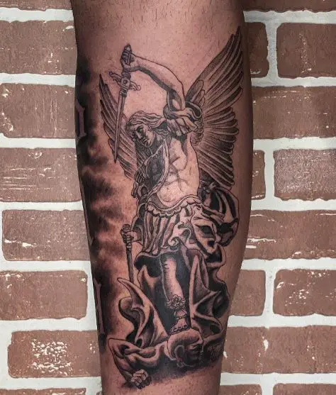 Black and Grey Saint Michael with Sword Defeating Satan Calf Tattoo