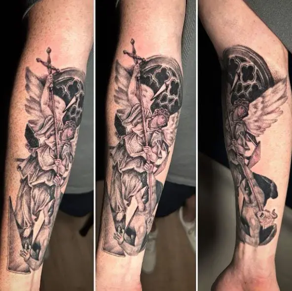 Black and Grey Saint Michael with Spear Defeating Satan Forearm Tattoo