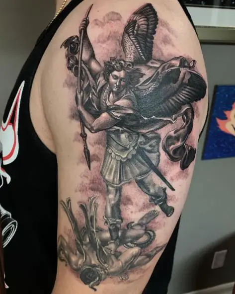 Black and Grey Saint Michael with Spear Defeating Satan Arm Tattoo