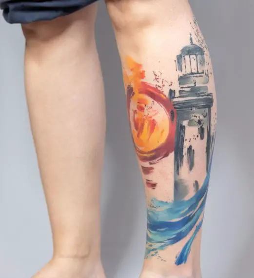 Colorful Sunset Landscape with Lighthouse Abstract Leg Tattoo