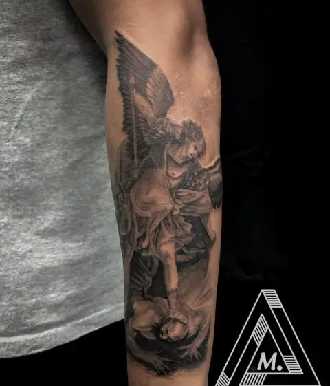 Black and Grey Saint Michael with Sword Defeating Satan Forearm Tattoo