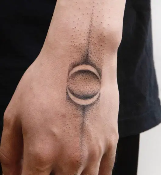Black and Grey Solar Eclipse Abstract Hand Tattoo