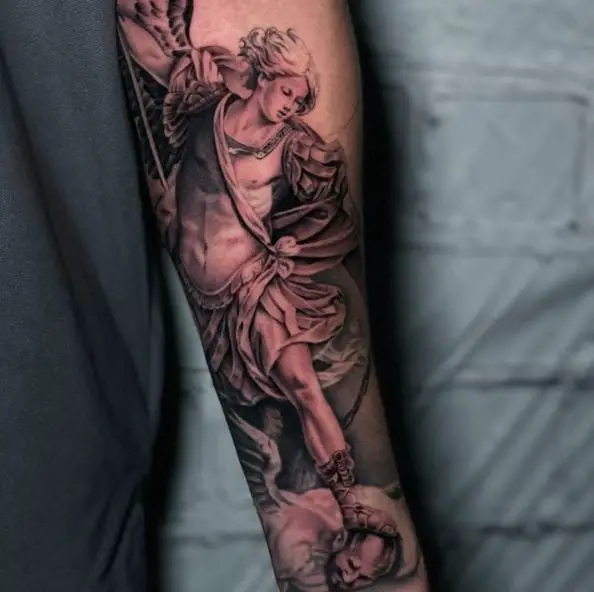 Black and Grey Saint Michael with Sword Defeating Satan Arm Tattoo