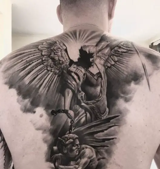 Sun and Saint Michael with Sword and Chain Defeating Satan Back Tattoo