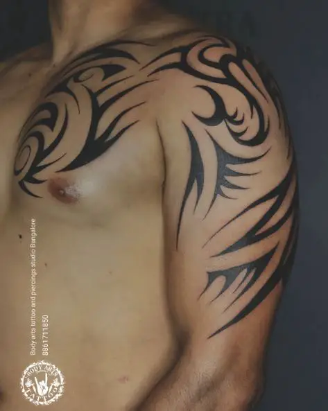 Black Maori Tribal Abstract Chest and Arm Tattoo