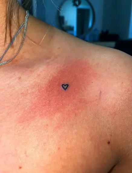 Minimalistic Black Heart Collarbone Tattoo