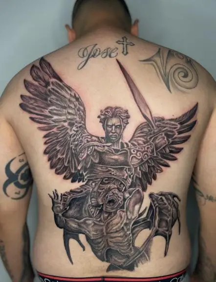 Black and Grey Saint Michael with Sword Defeating Satan Back Tattoo