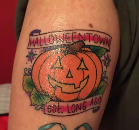Colorful Pumpkin and Halloween Town Banner Arm Tattoo