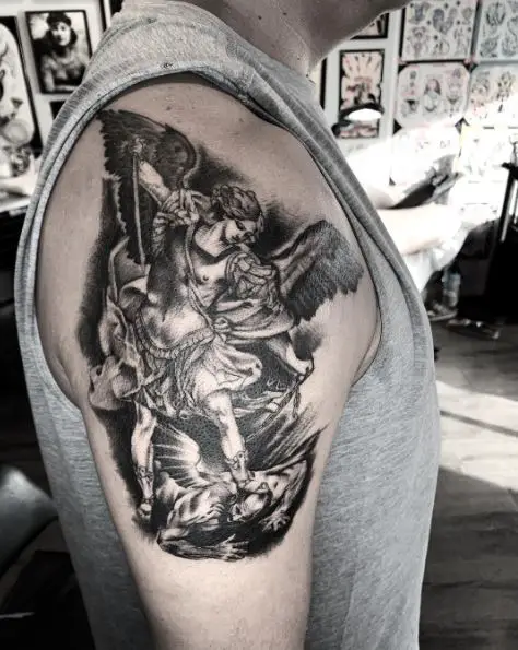 Black and Grey Saint Michael with Sword and Chain Defeating Satan Arm Tattoo