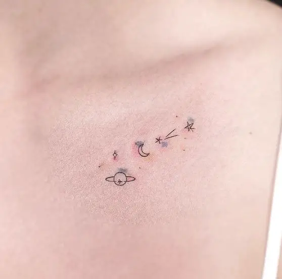 Black and Grey Saturn, Moon and Stars Collarbone Tattoo