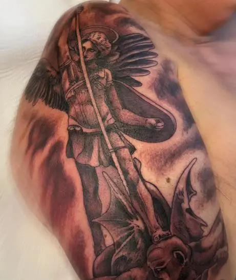 Black and Grey Saint Michael with Spear and Shield Defeating Satan Arm Tattoo