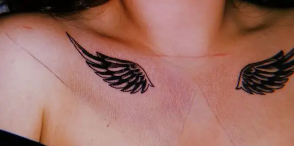 Black and Grey Angel Wings Collarbone Tattoo