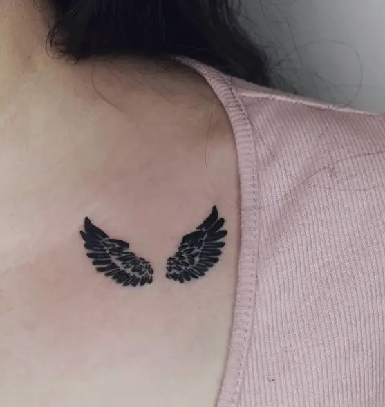 Black and Grey Angel Wings Collarbone Tattoo