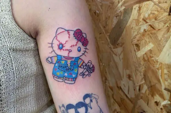 Colorful Hello Kitty as Chucky Crossover Arm Tattoo