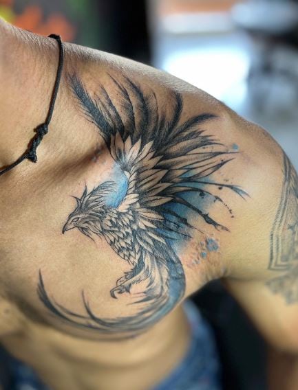 Black Phoenix Bird with Blue Splash Shoulder Tattoo