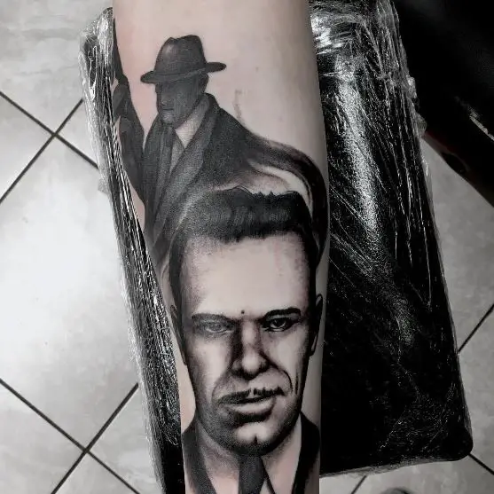Black and Grey John Dillinger Sleeve Tattoo