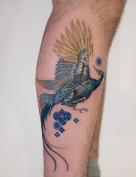 Blue Ink Phoenix Leg Tattoo