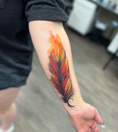 Colorful Watercolor Feather Forearm Tattoo