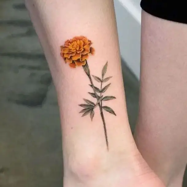 A Stem of Marigold Flower Ankle Tattoo