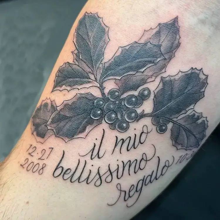 Black Ink Holly Flower With Text Tattoo