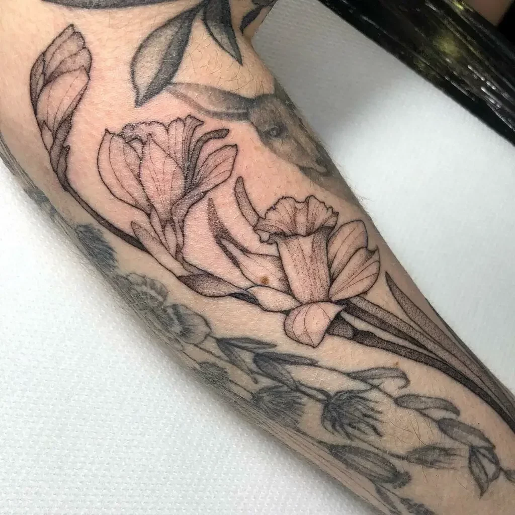Detailed Line Work Daffodils Flower Arm Tattoo